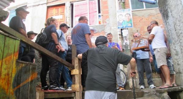 Local guide with a group of tourists visiting the favelas